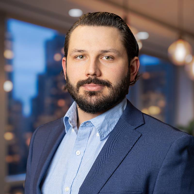 Bearded man in blue suit in office