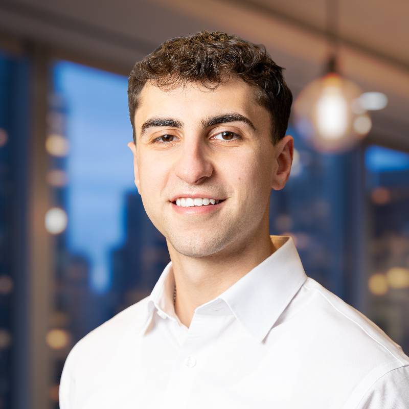 Smiling young man in modern office setting